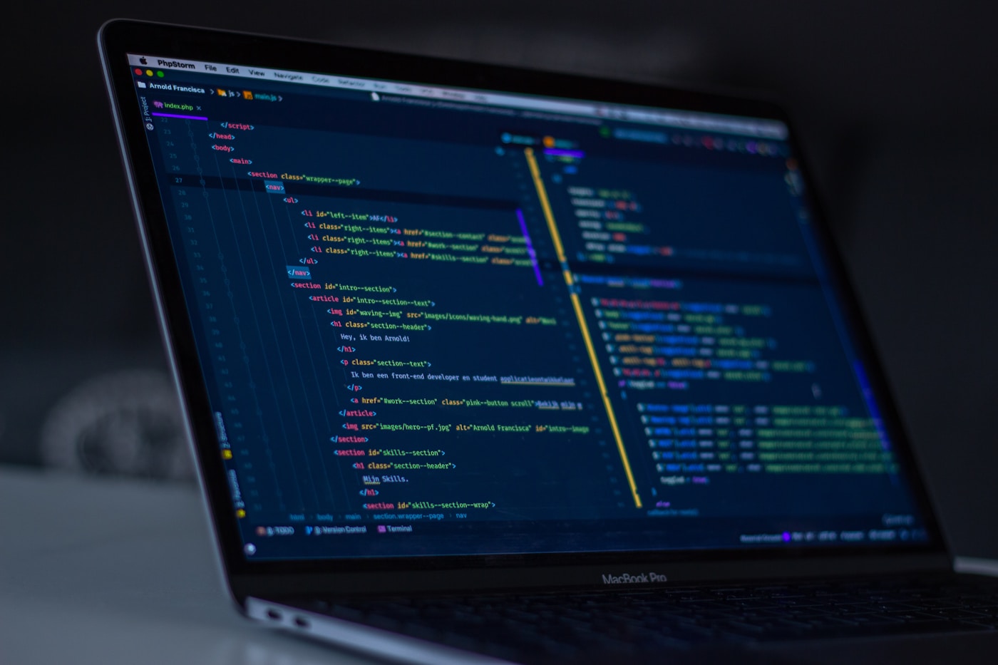 Engineer reviewing frontend architecture on multiple monitors