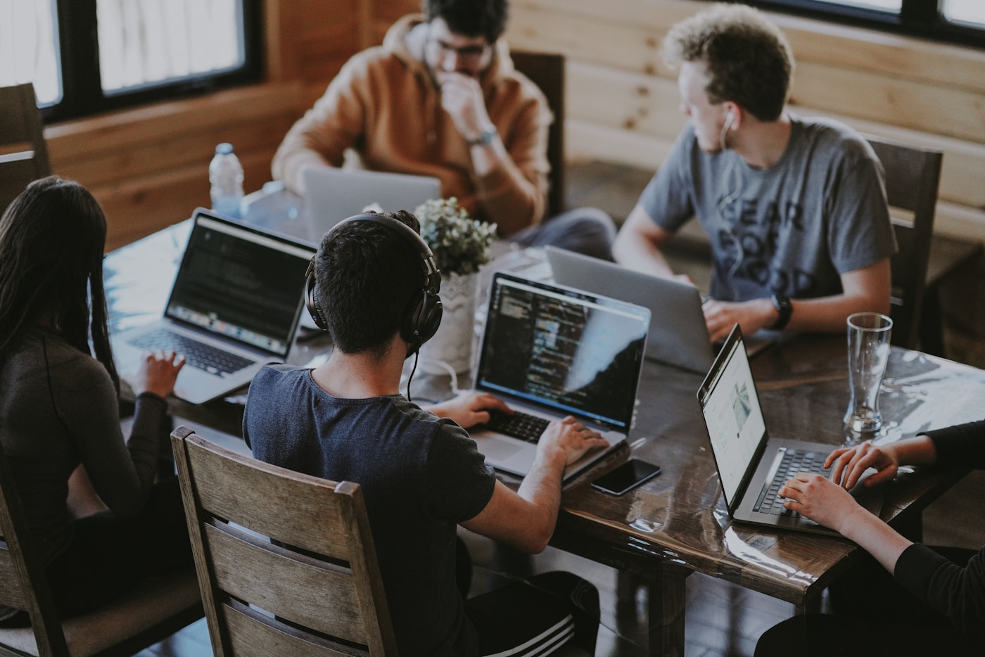 Product engineering team collaborating around a sprint board